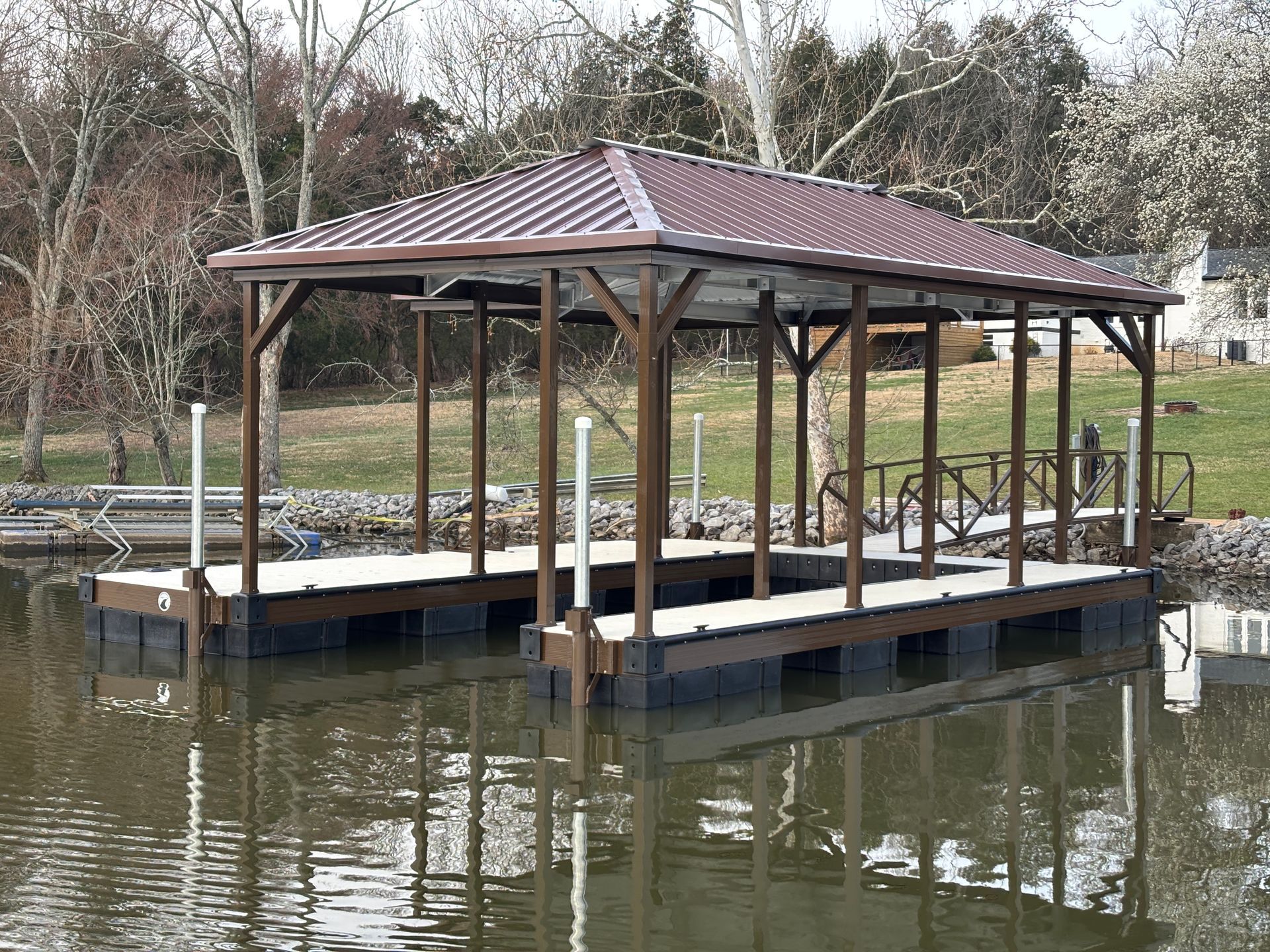 An aerial view of a boat dock on a lake.
