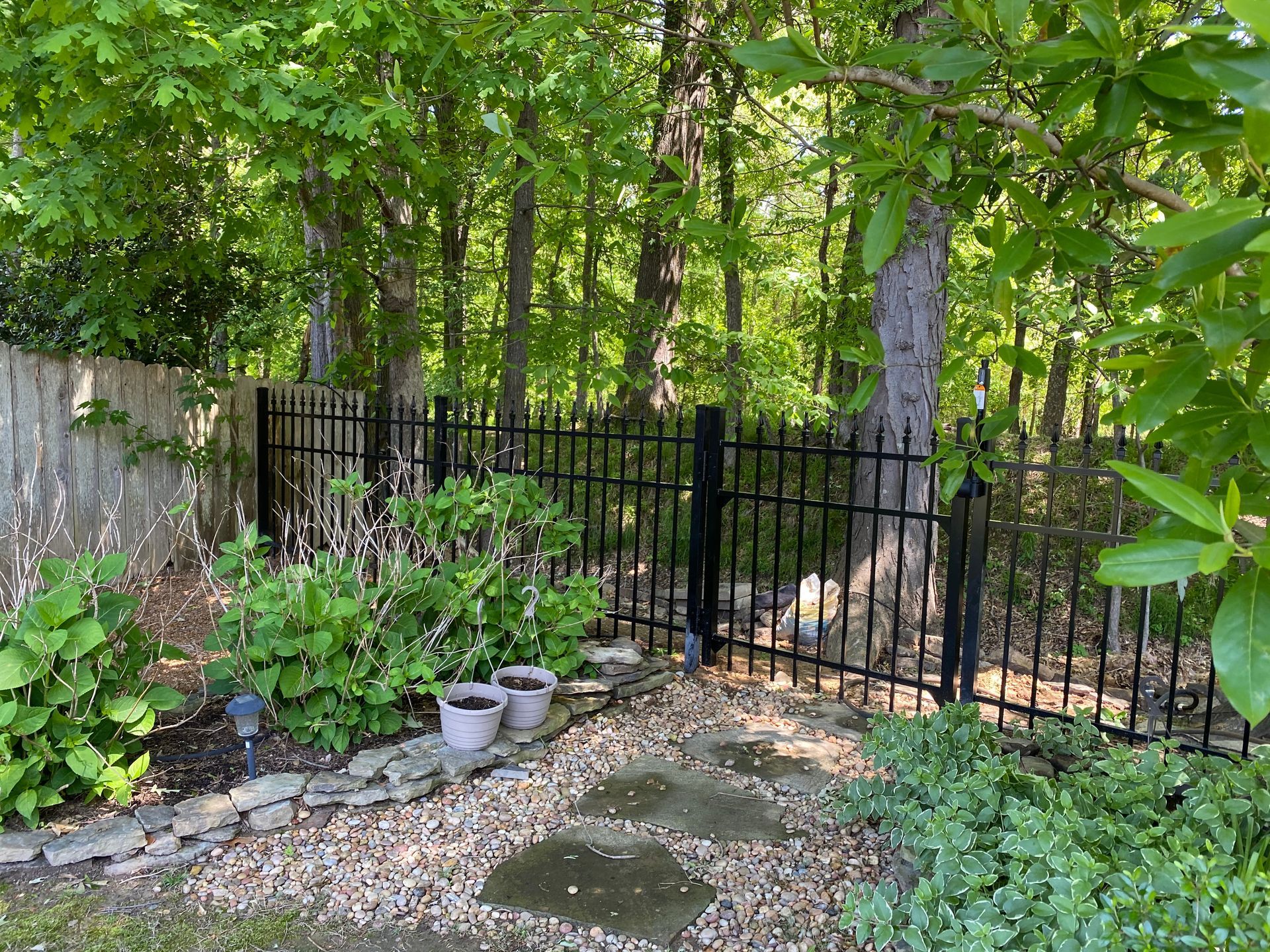 Iron fence added to garden