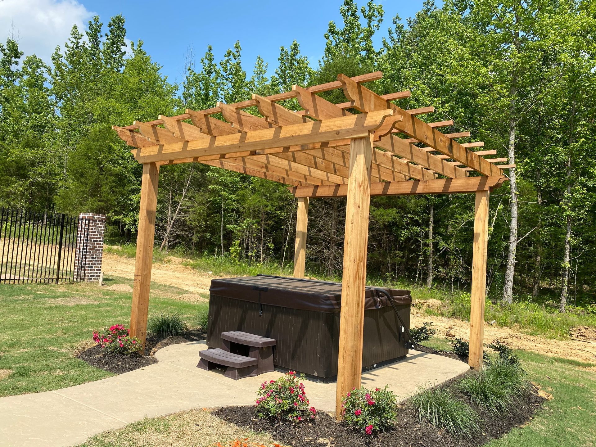 Freestanding cedar pergola on hottub pad
