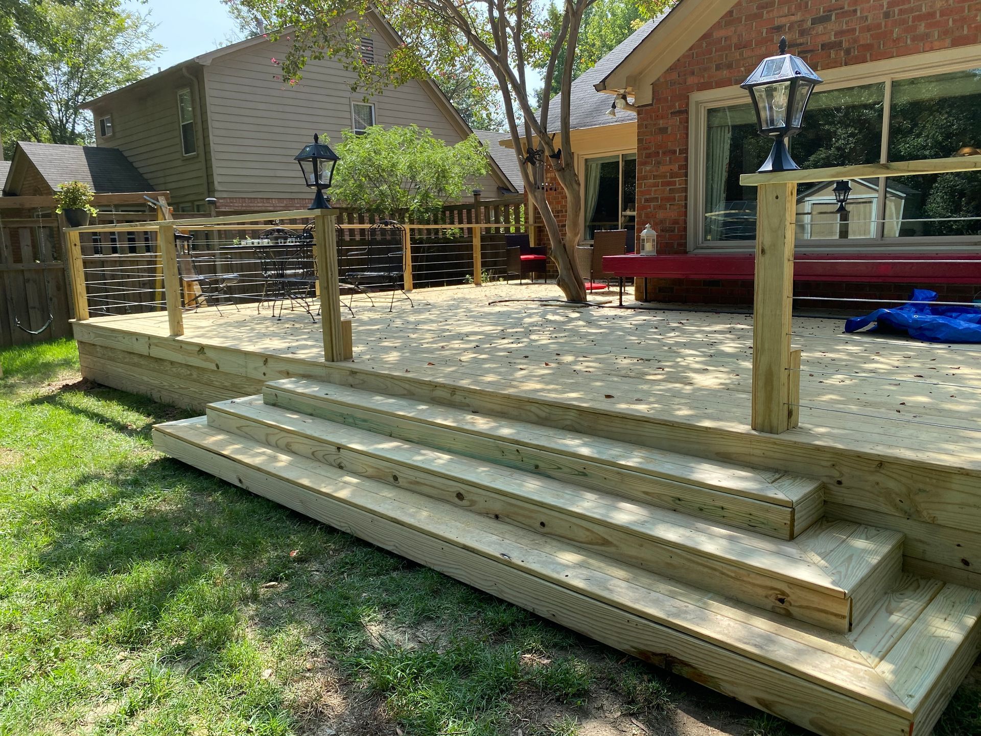 pressure treated deck with steel cable railing