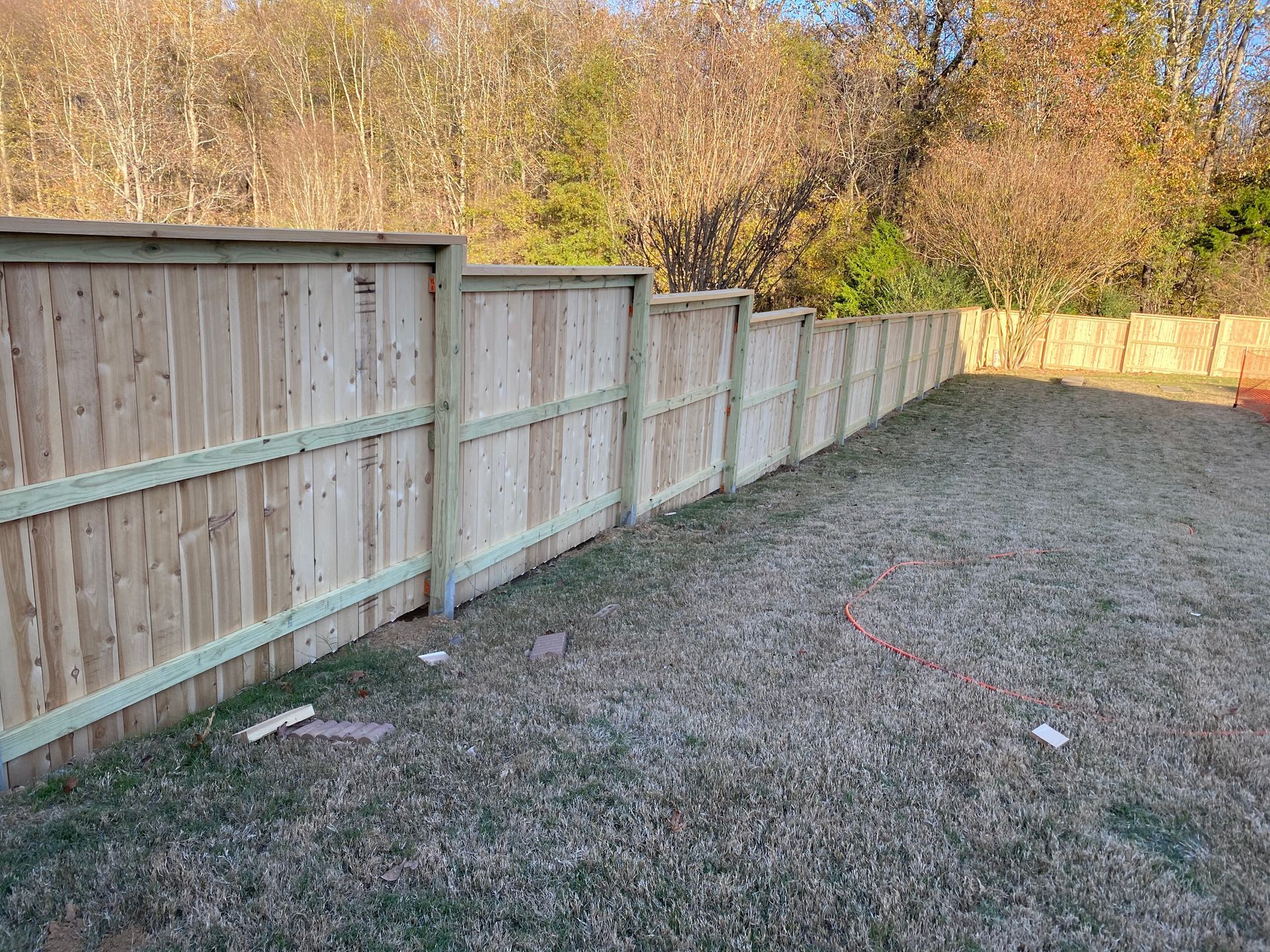 6 foot picture frame. style fence using 6x6 post with cap and fascia