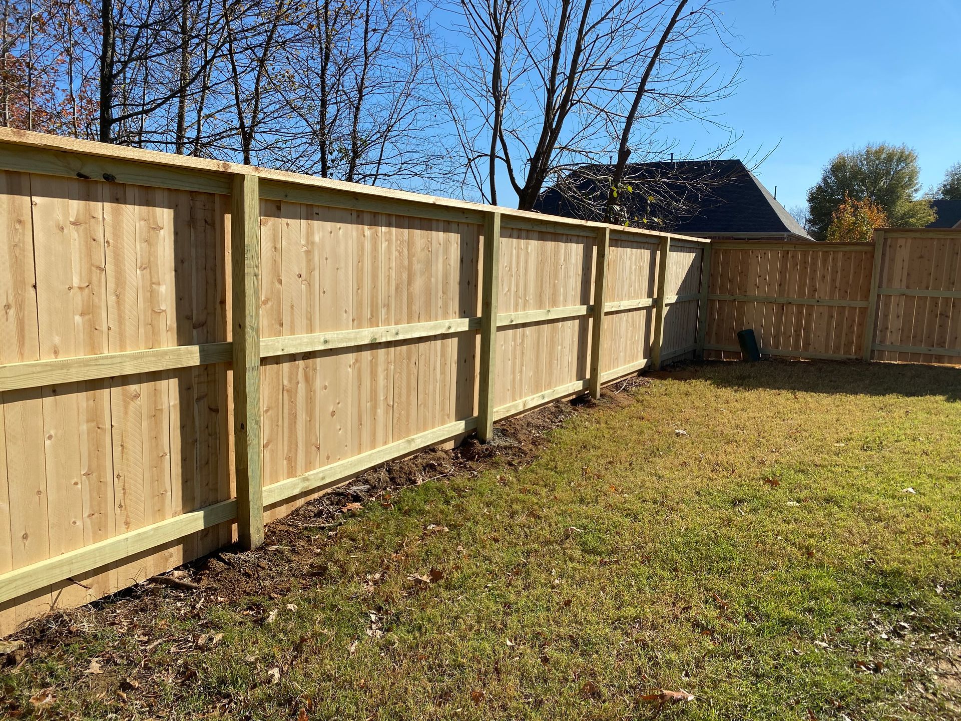 6 foot picture frame. style fence using 6x6 post with cap and fascia