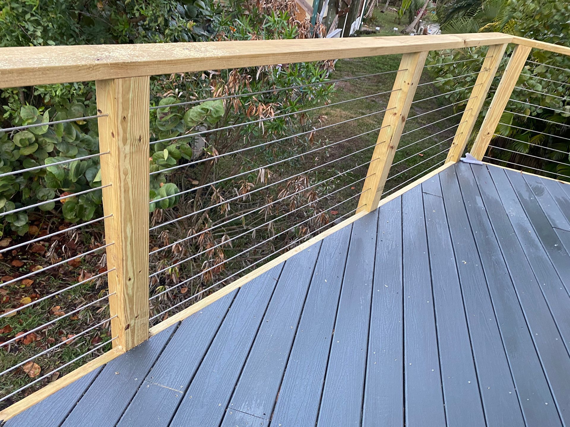 Composite decking with steel cable railing