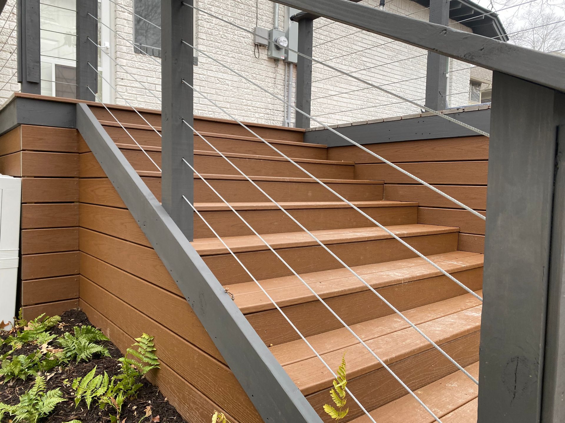 Steel cable railing with composite decking