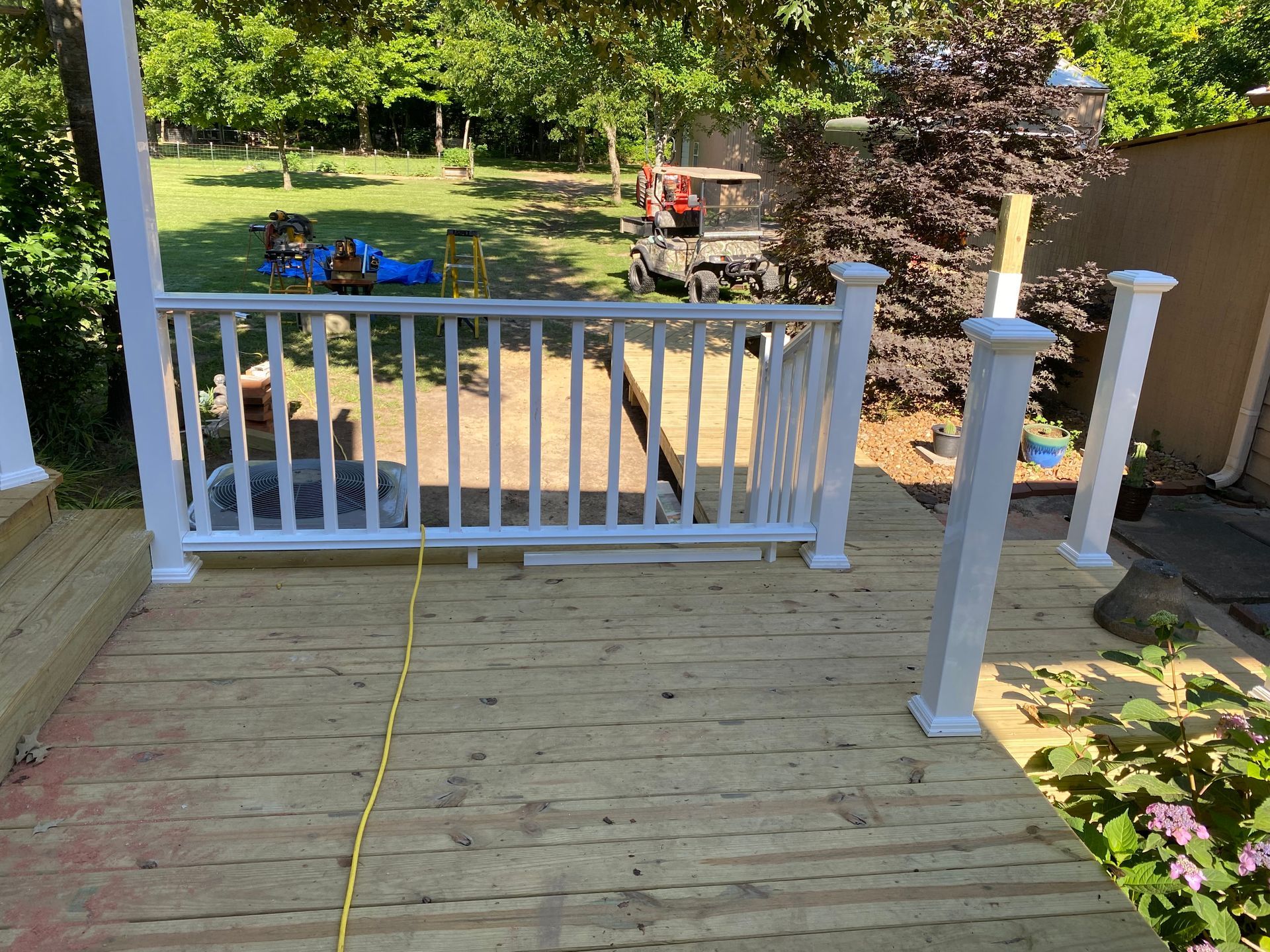 New treated deck with composite railing and redwood pergola