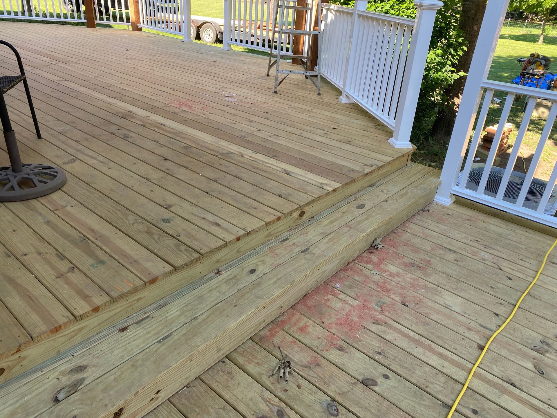 New treated deck with composite railing and redwood pergola