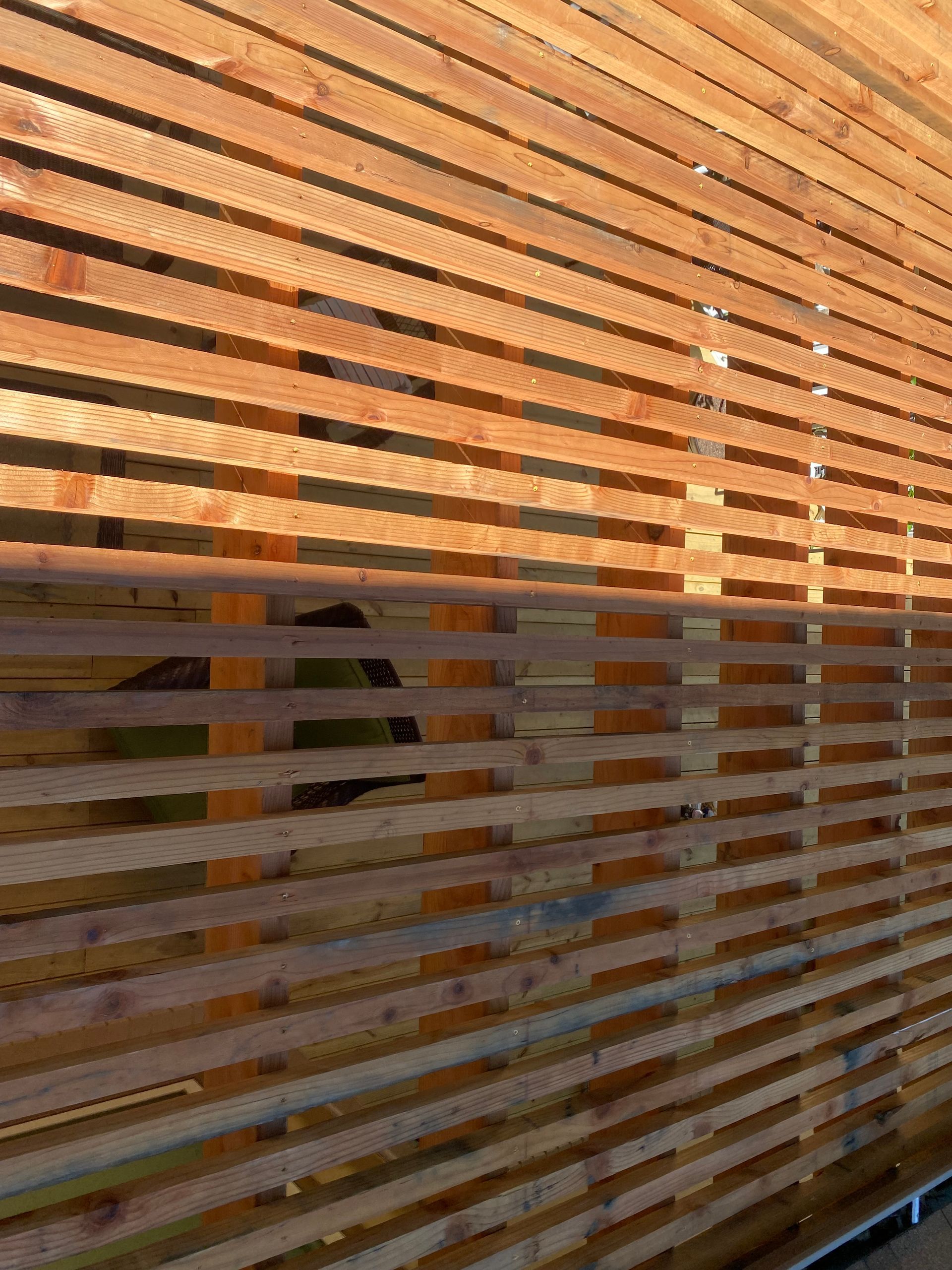 2x2 redwood slats on top of pergola