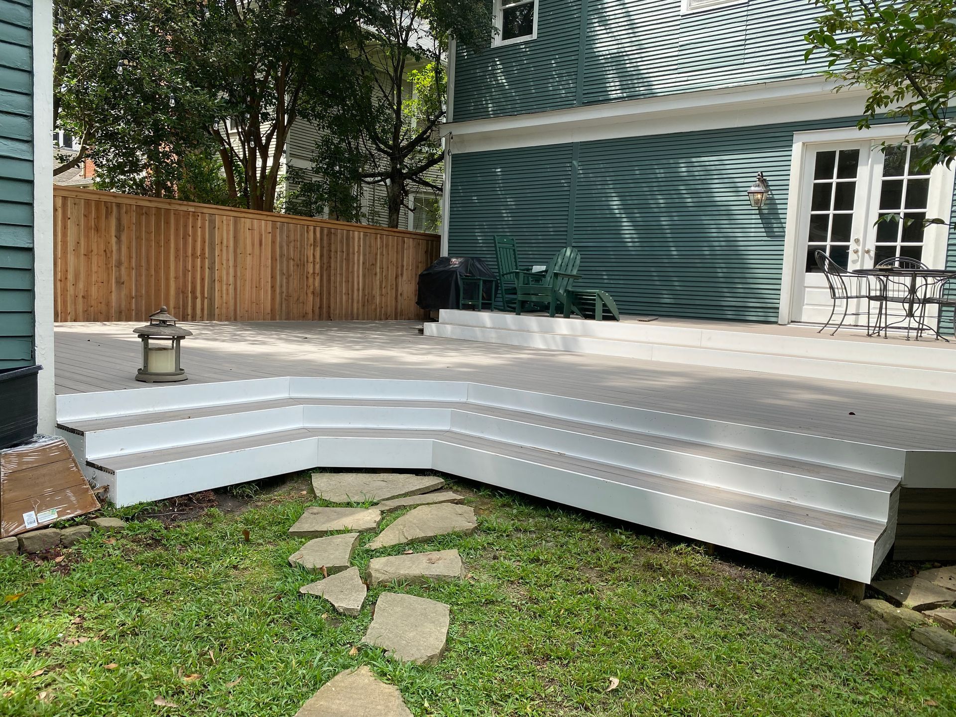 Composite deck with cedar fence behind