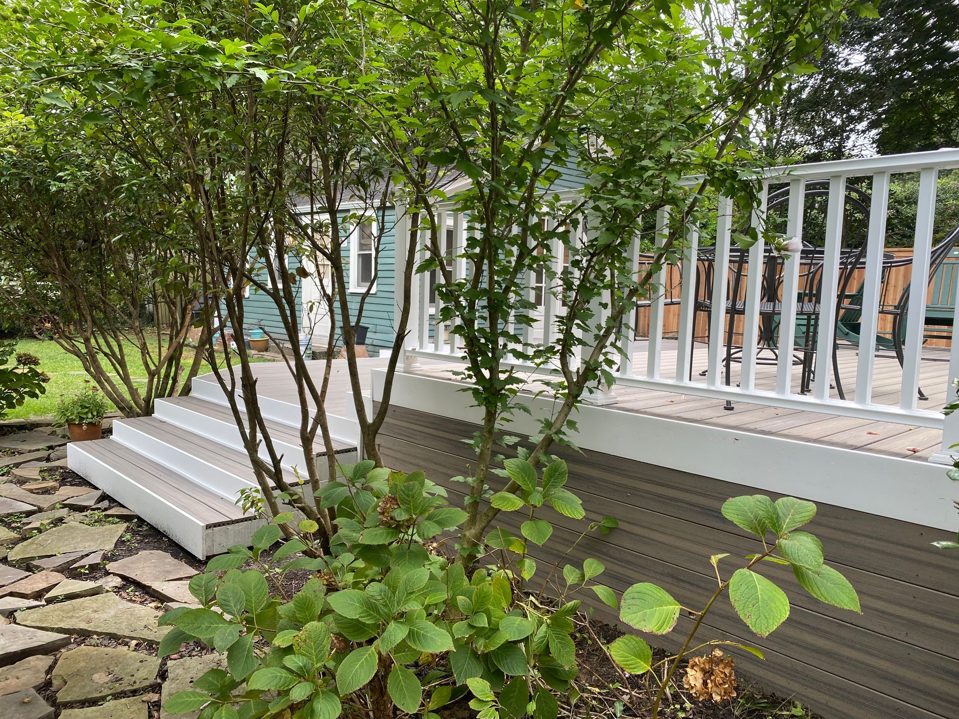 Composite deck with composite railing