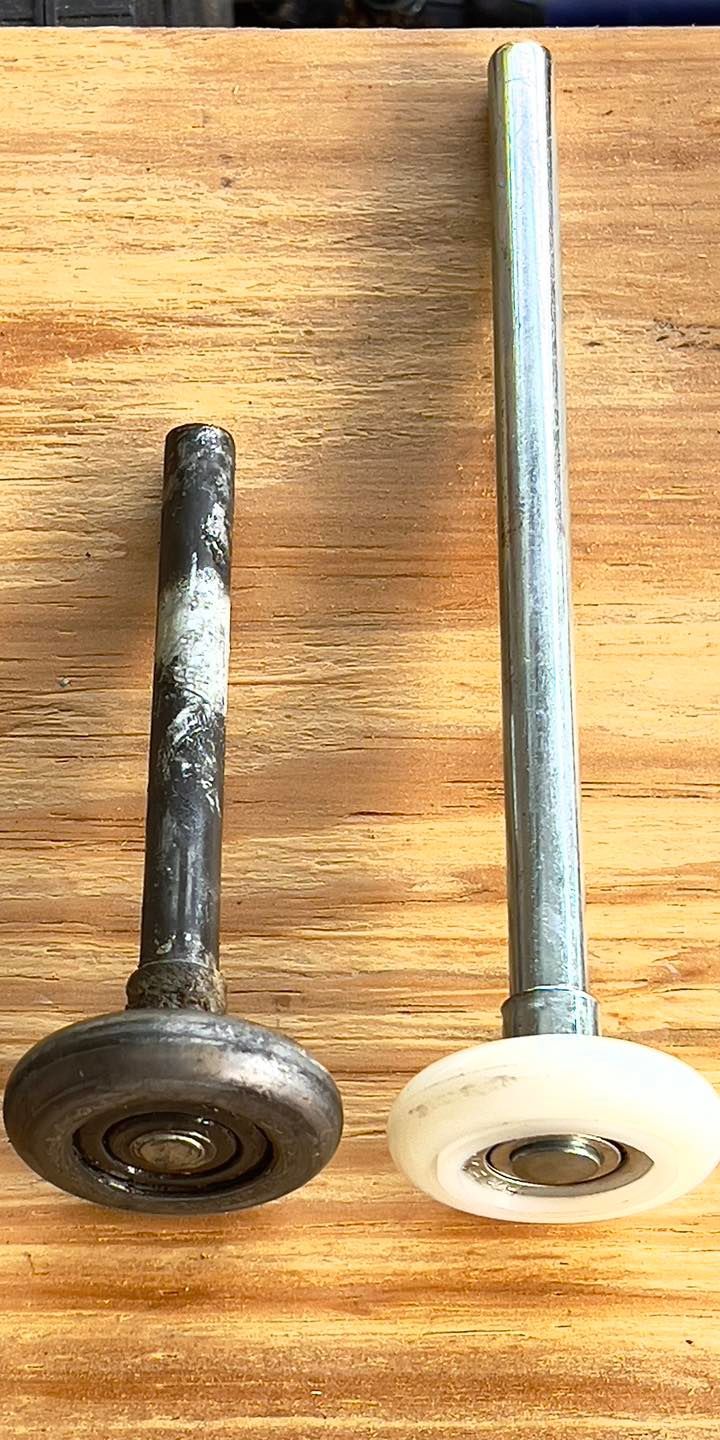 Two rollers are sitting next to each other on a wooden table.