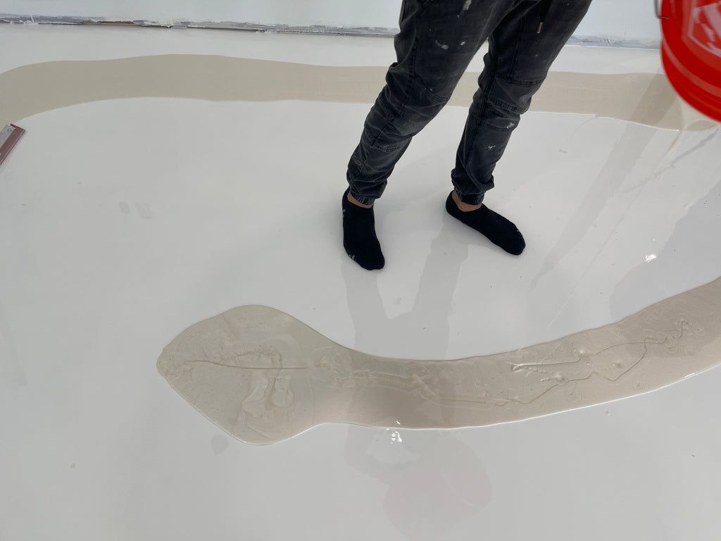 Poured epoxy resin on a cleaned and prepared concrete floor.