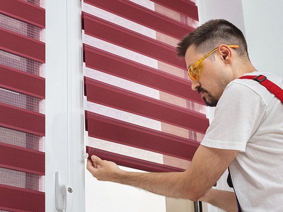 Man Holding Window Blind — San Diego, CA — Blind Speed-Sparkle Blinds
