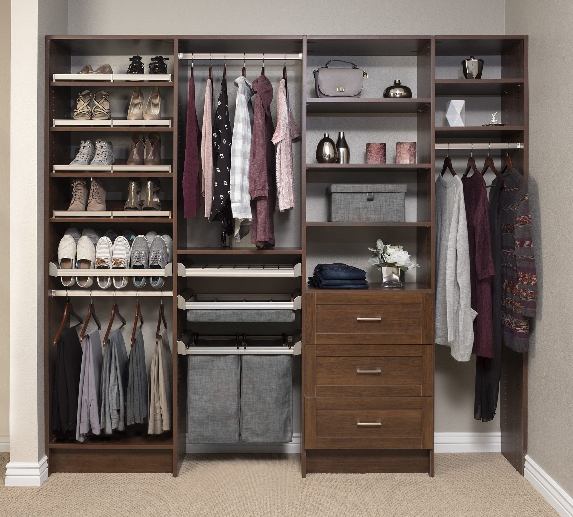 A walk in closet filled with clothes and shoes
