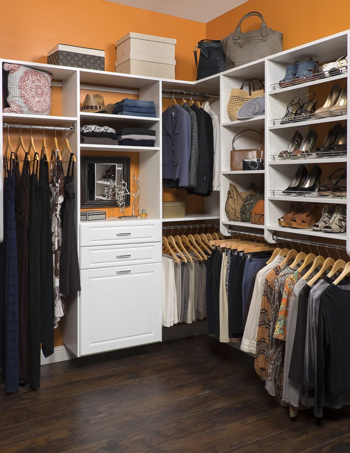 A walk in closet filled with clothes and shoes