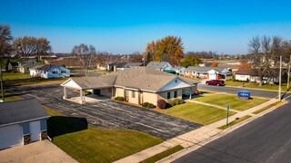 An aerial view of a house in a residential neighborhood.