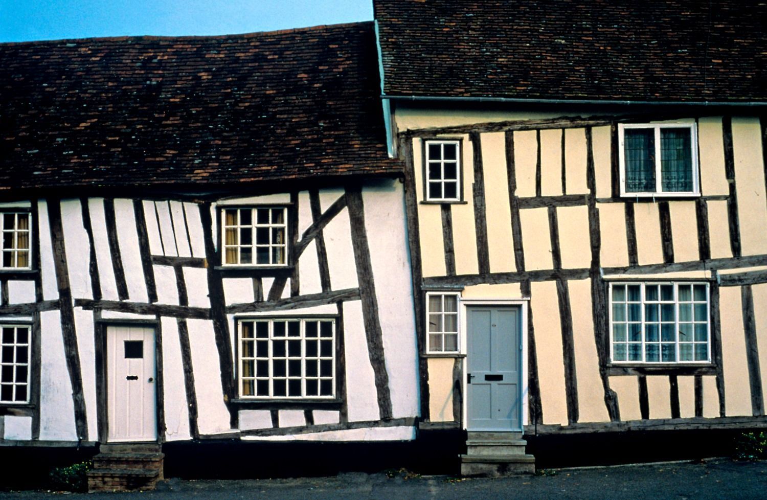 Listed timber framed building with painted front doors by DMB Painting and Decorating