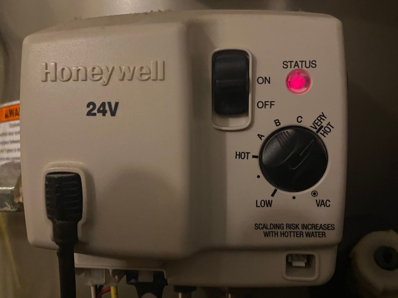 A honeywell water heater with a red light on it