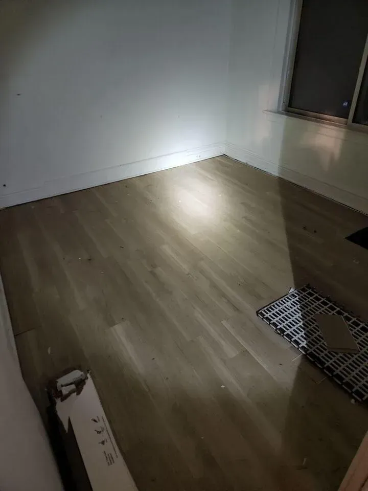 Laminate flooring installation during home renovation by BRC Contracting Inc.