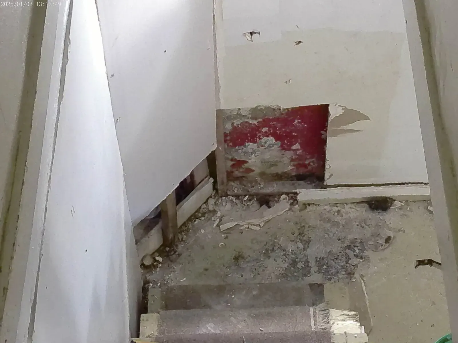 Ongoing stairwell demolition and drywall removal for home remodeling