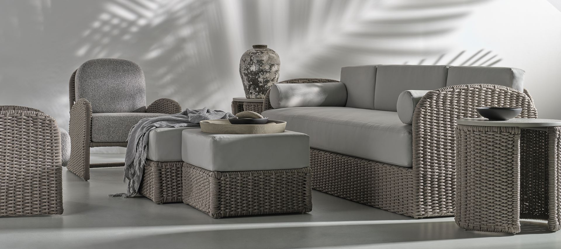 A living room with wicker furniture and a couch