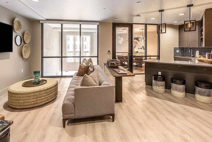 A living room with a couch , coffee table , and television.