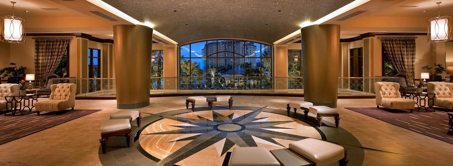 A hotel lobby with a circular pattern on the floor