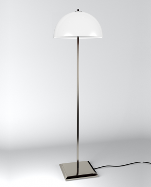 A white lamp is sitting on a white surface