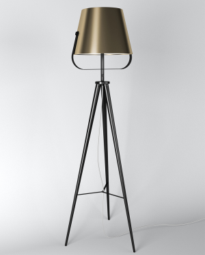 A lamp on a tripod with a gold shade