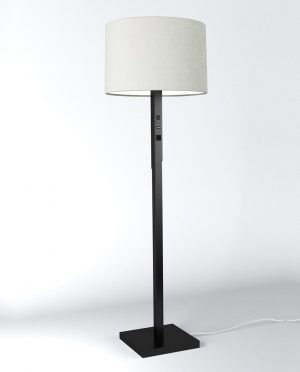 A black floor lamp with a white shade on a white surface.
