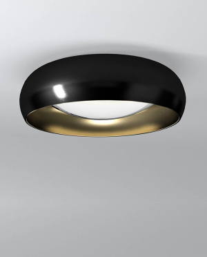 A black and gold ring is hanging from the ceiling.