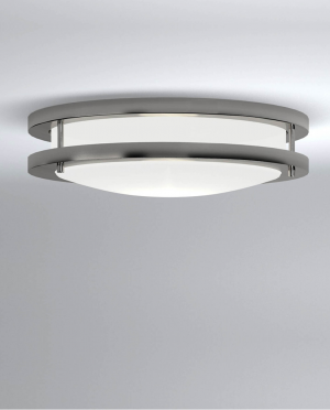 A ceiling light with two white shades on a white wall.