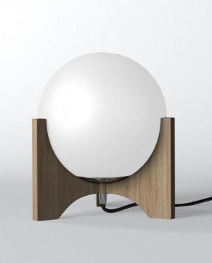 A lamp with a white glass globe on a wooden stand