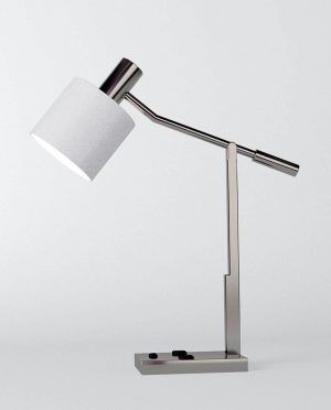 A table lamp with a white shade on a white background.