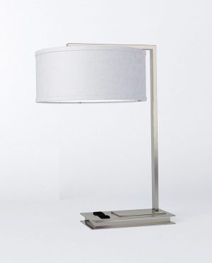 A table lamp with a white shade on a white background.