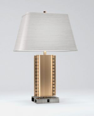 A table lamp with a white shade on a white background.