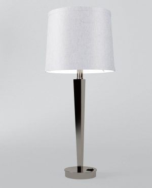 A table lamp with a white shade on a white background