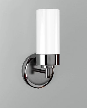 A wall light with a white glass shade is mounted on a wall.