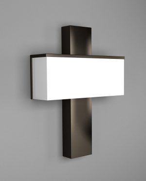 A cross shaped wall light with a white shade on a gray wall.