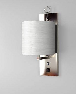 A wall light with a white shade on a white wall.