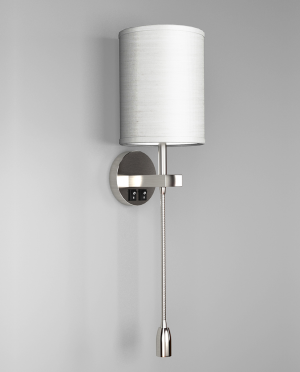 A wall mounted lamp with a white shade