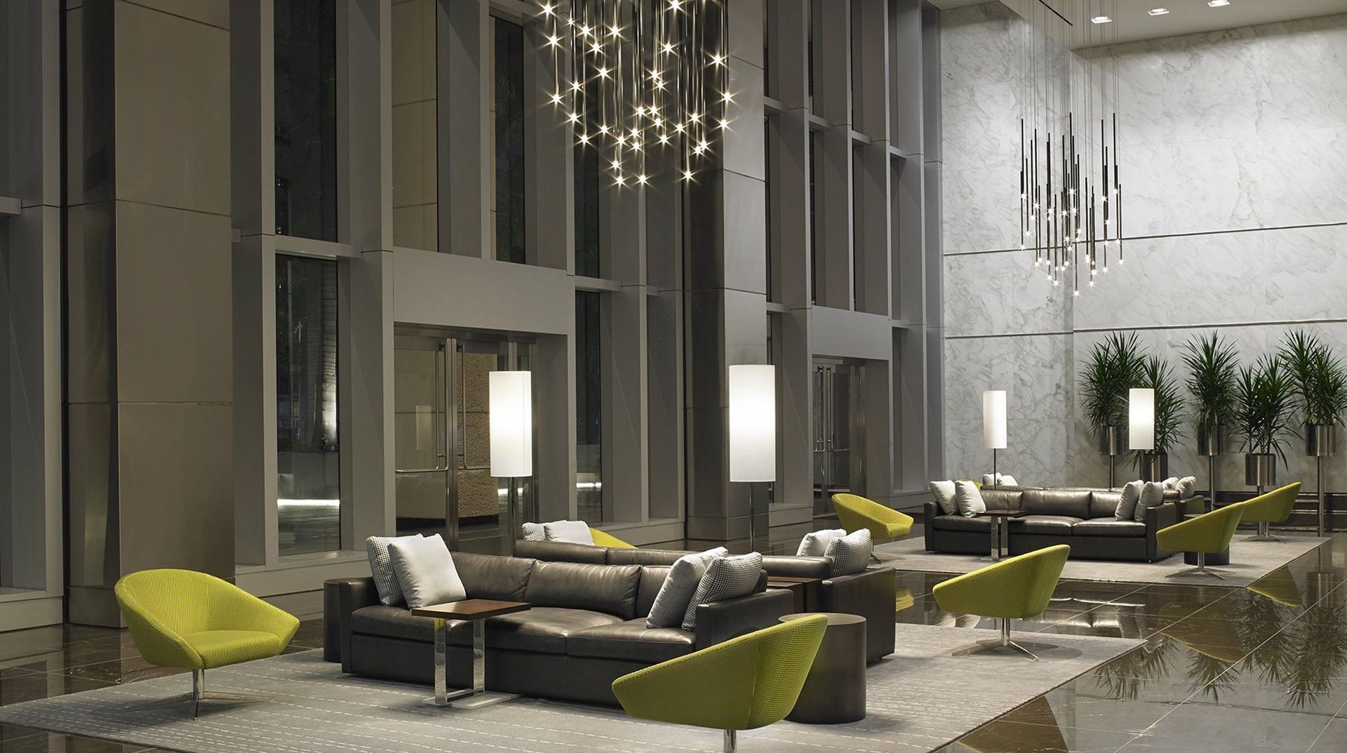 A lobby with a lot of furniture and a chandelier