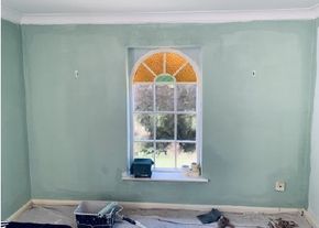 Image showing room in progress of being repainted. Walls, ceiling and woodwork all freshly decorated