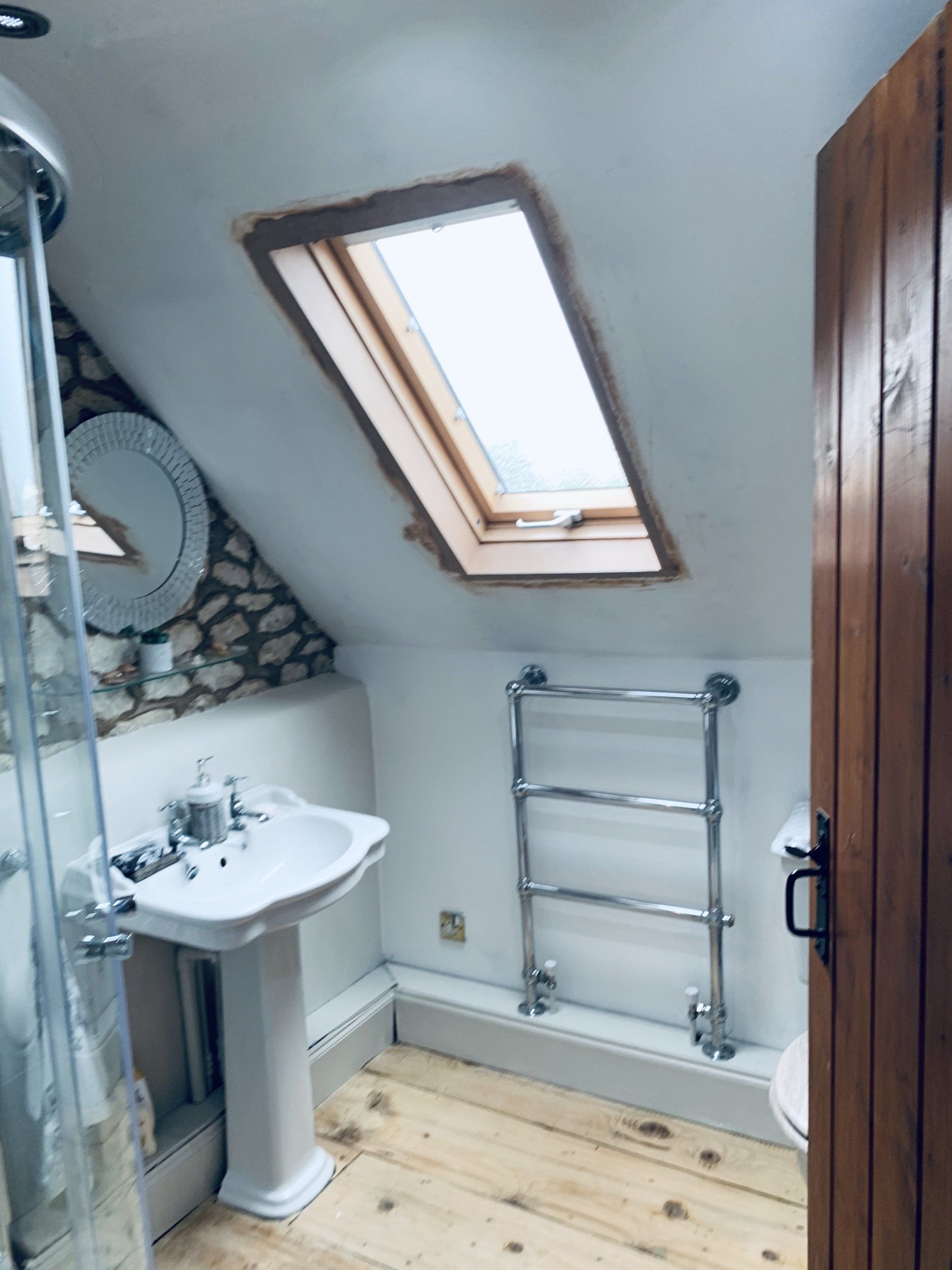 Image of previous project - Completed re-plastering and decorating of bathroom with sloping ceiling