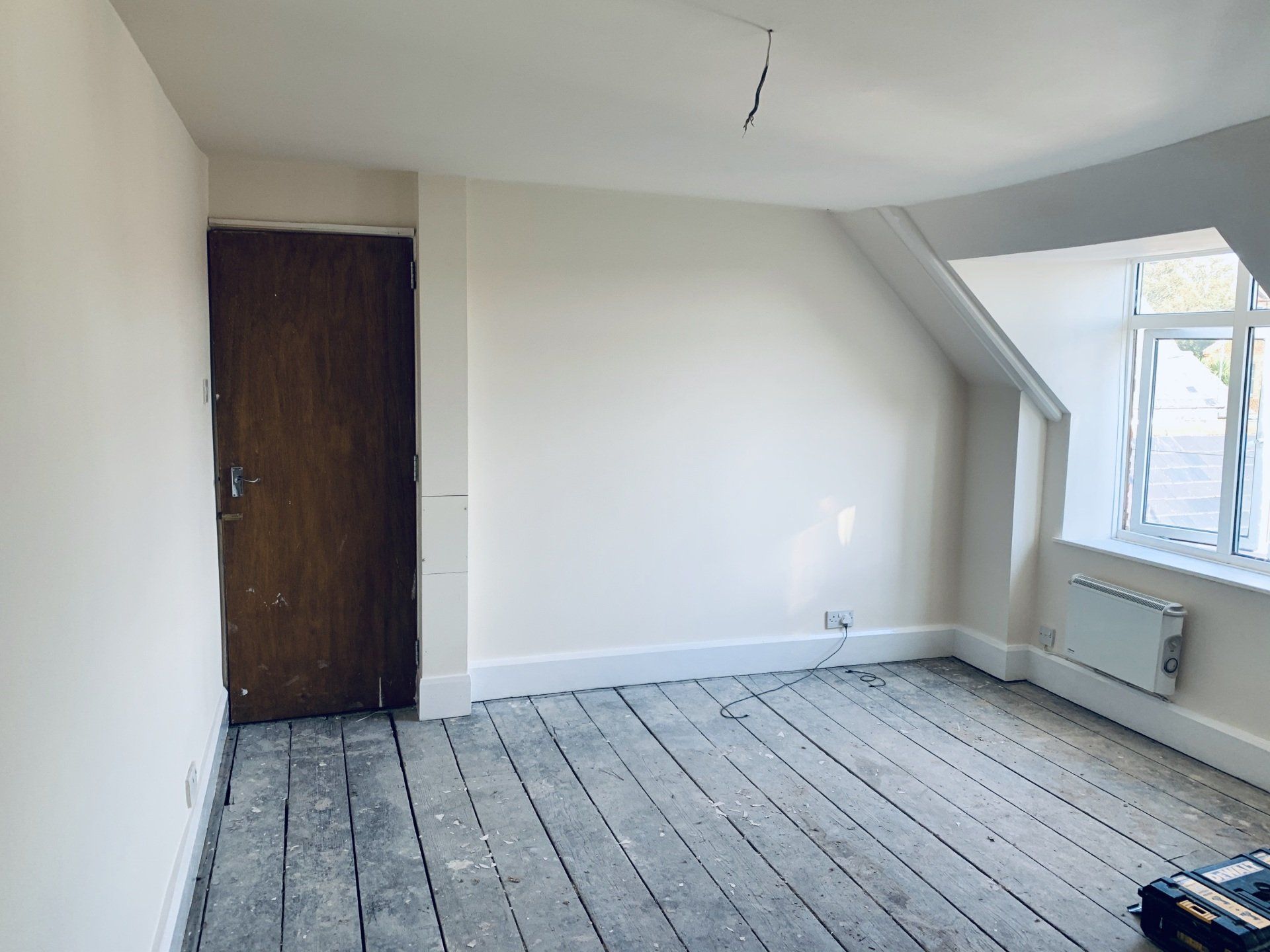 Image showing completed project - Walls and ceiling having been re-plastered and decorated in fresh white paint