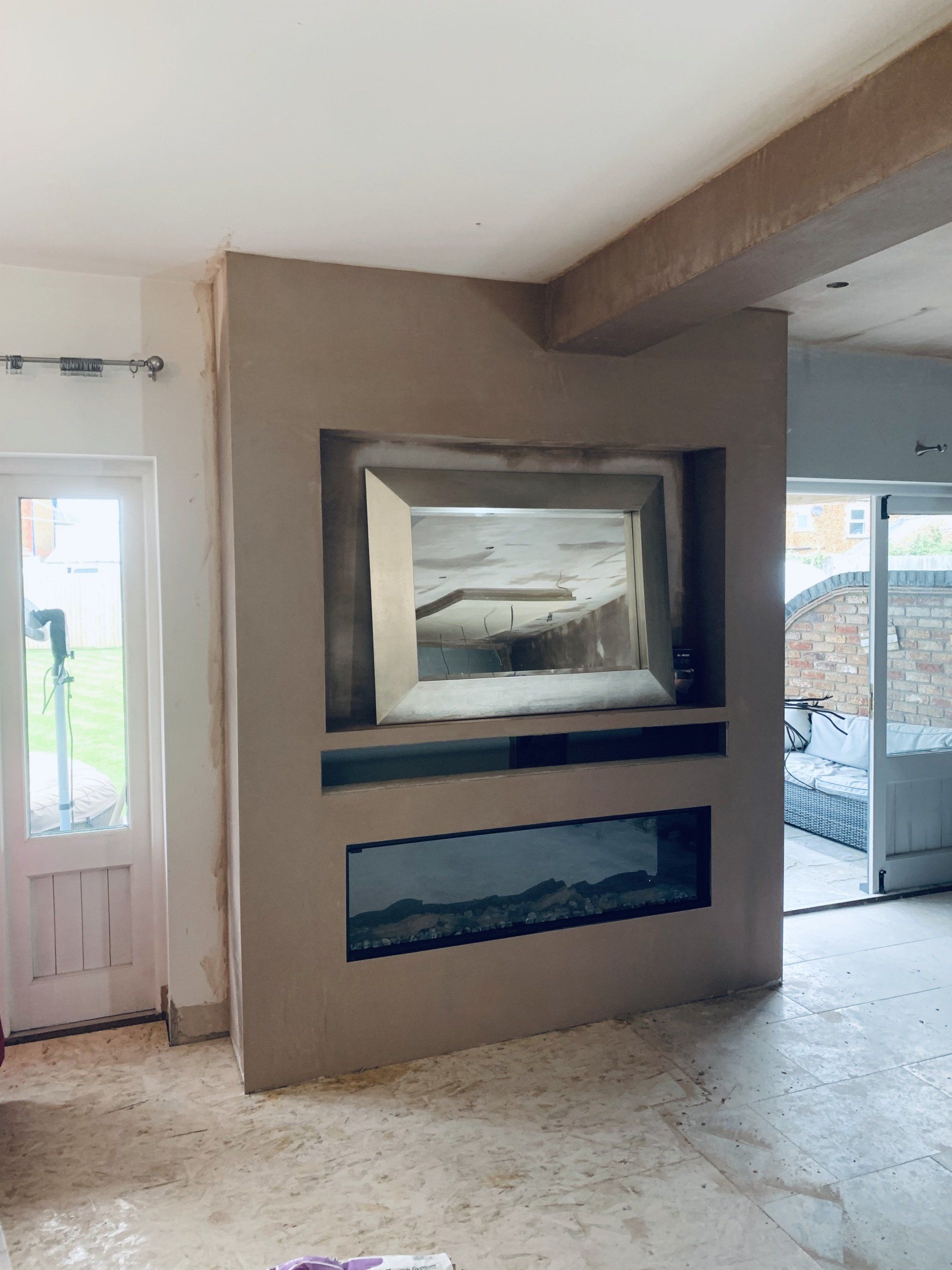 Image depicting a previous project - Plastering of newly constructed media wall in progress of being plastered