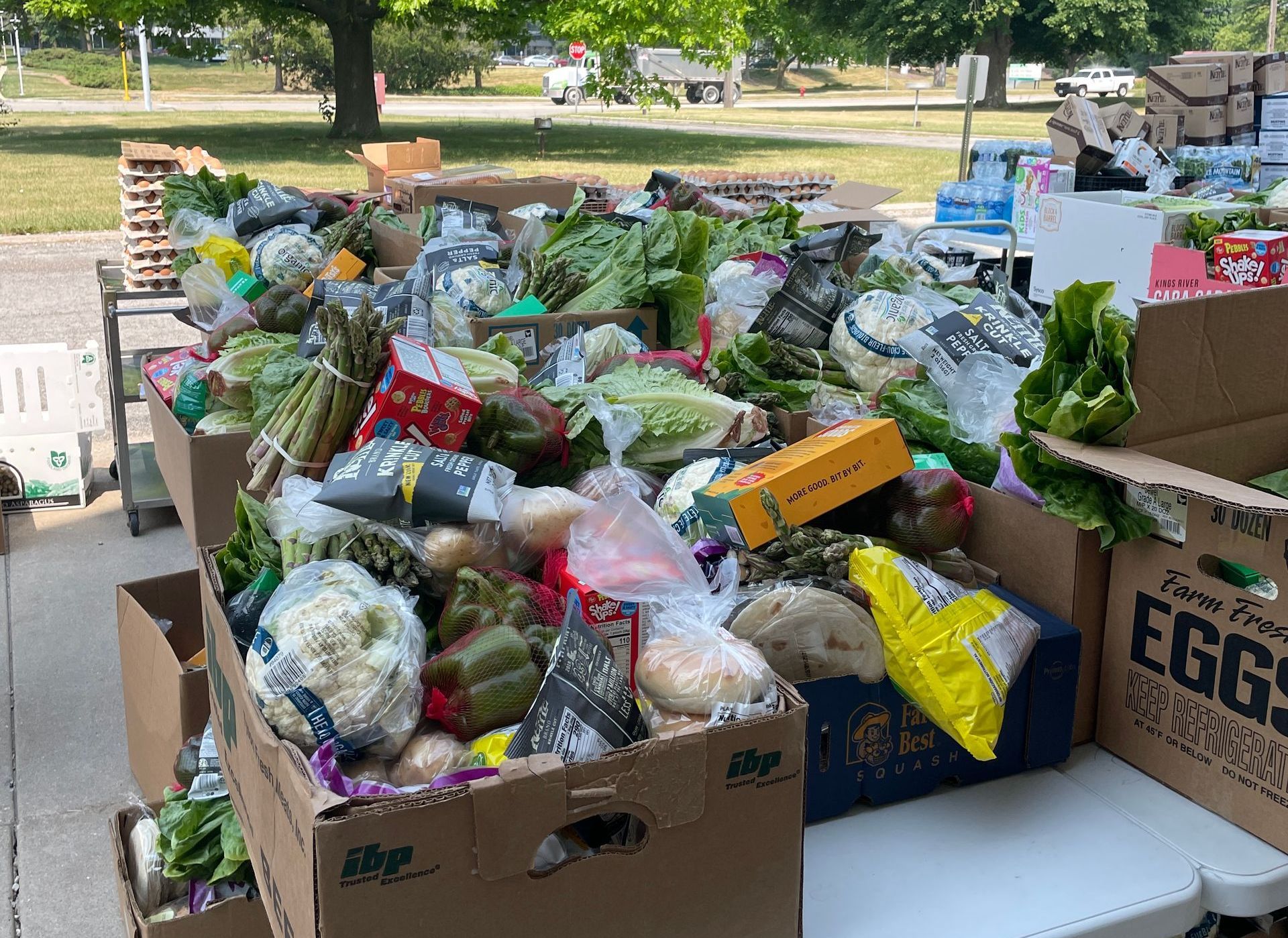 A bunch of boxes filled with vegetables.