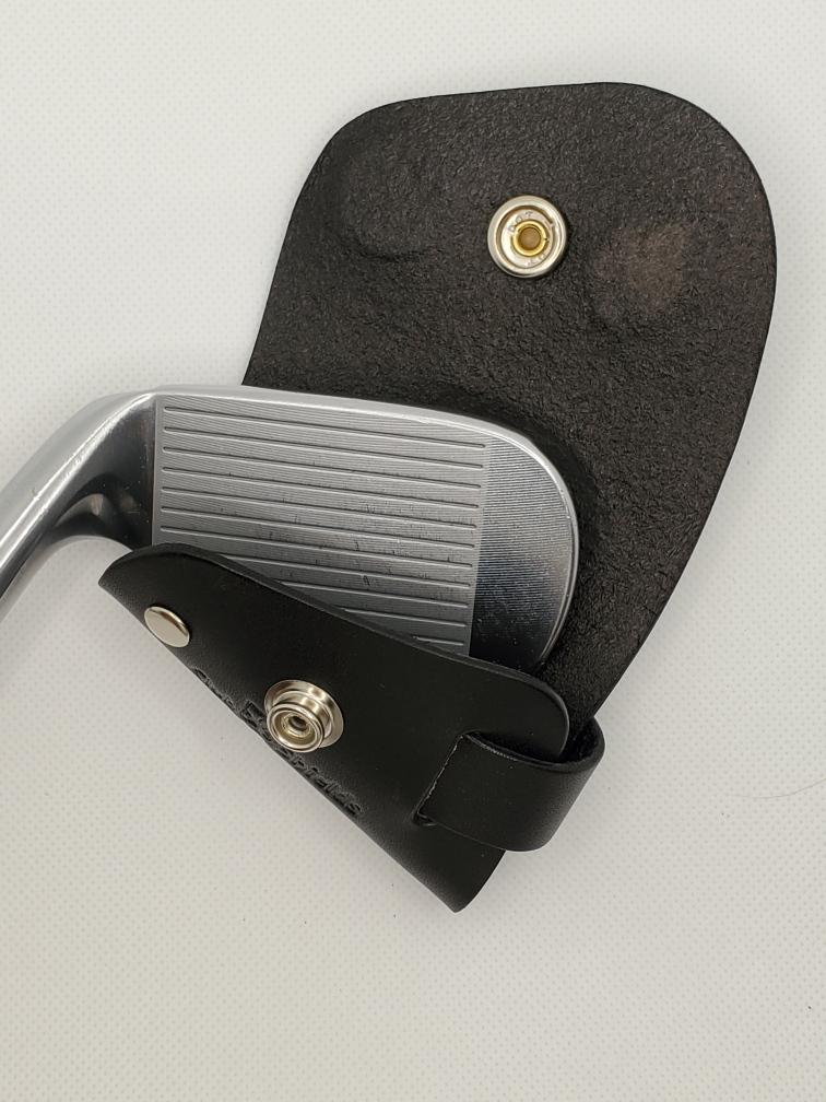 Black leather golf club head cover with a  club head.