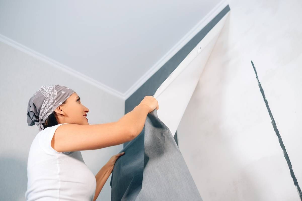 A homeowner trying wallpaper removal near Des Moines & Waukee, IA and Omaha, NE