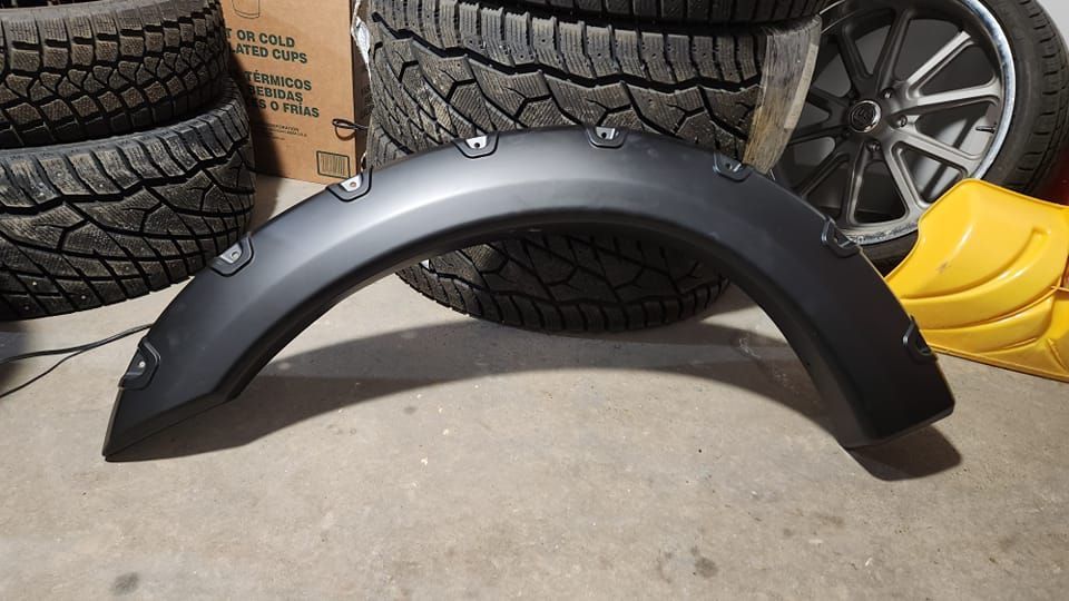Black Fender Flare And Tire Stack In Garage | KK’S GARAGE