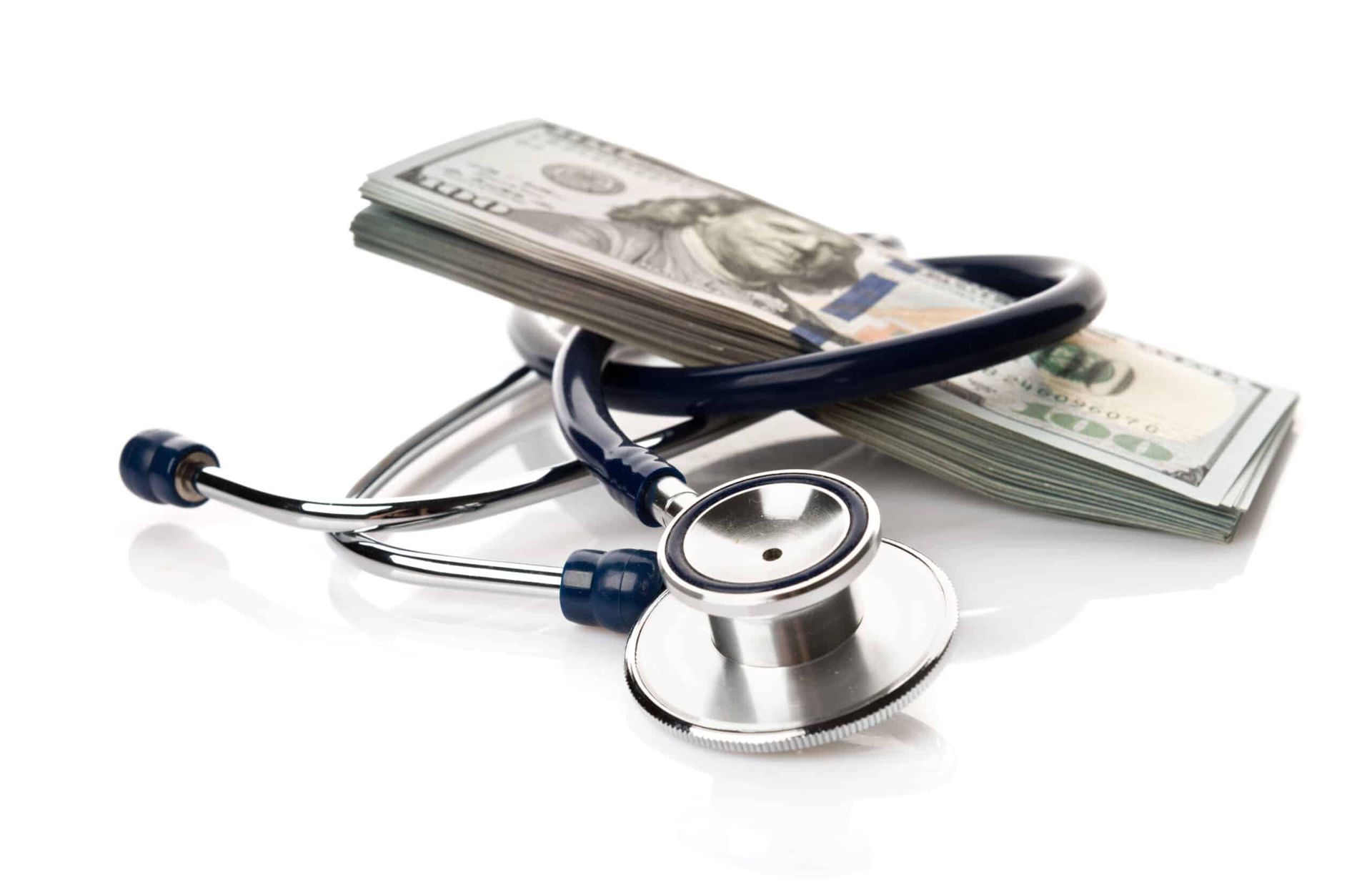 Stethoscope wrapped around a stack of $100 bills, symbolizing high healthcare costs.